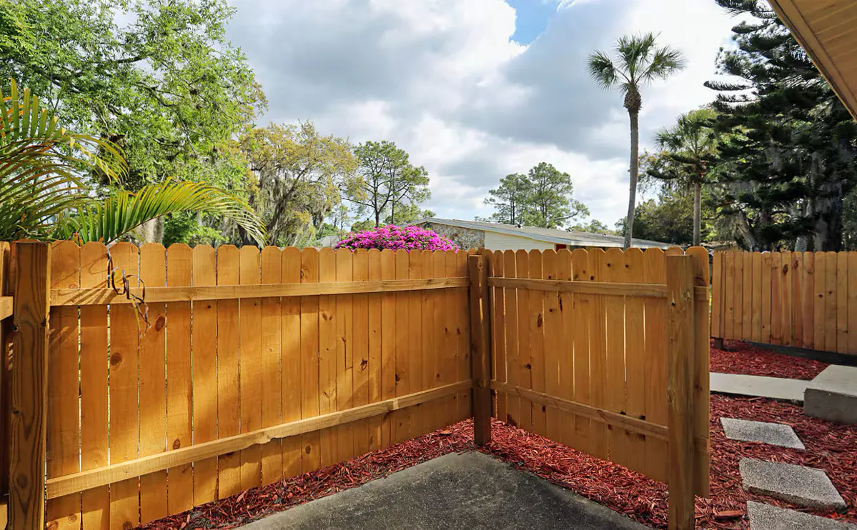 Fenced private patio beside a Morningside apartment home